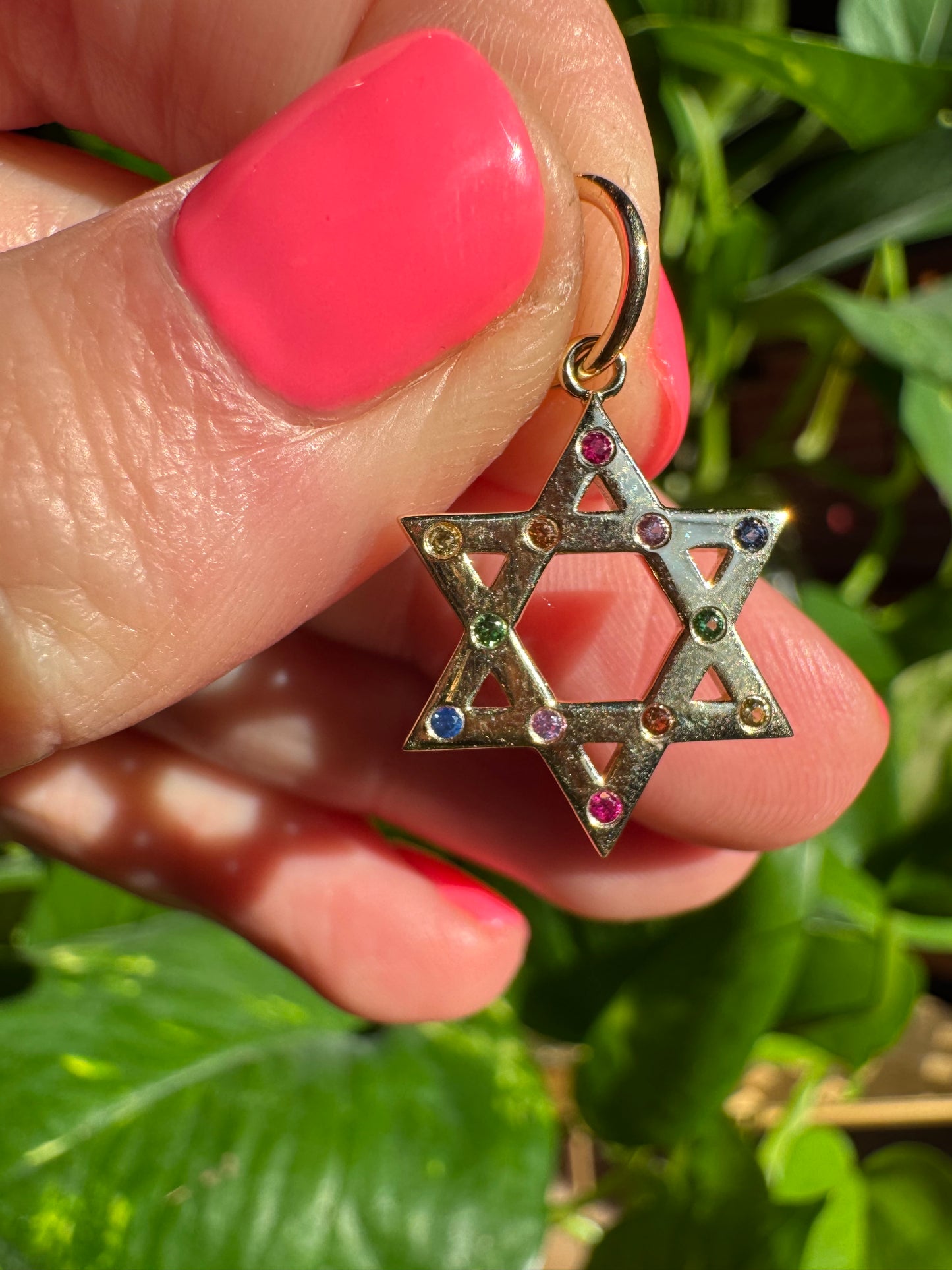 14k yellow gold with rainbow sapphire star!
