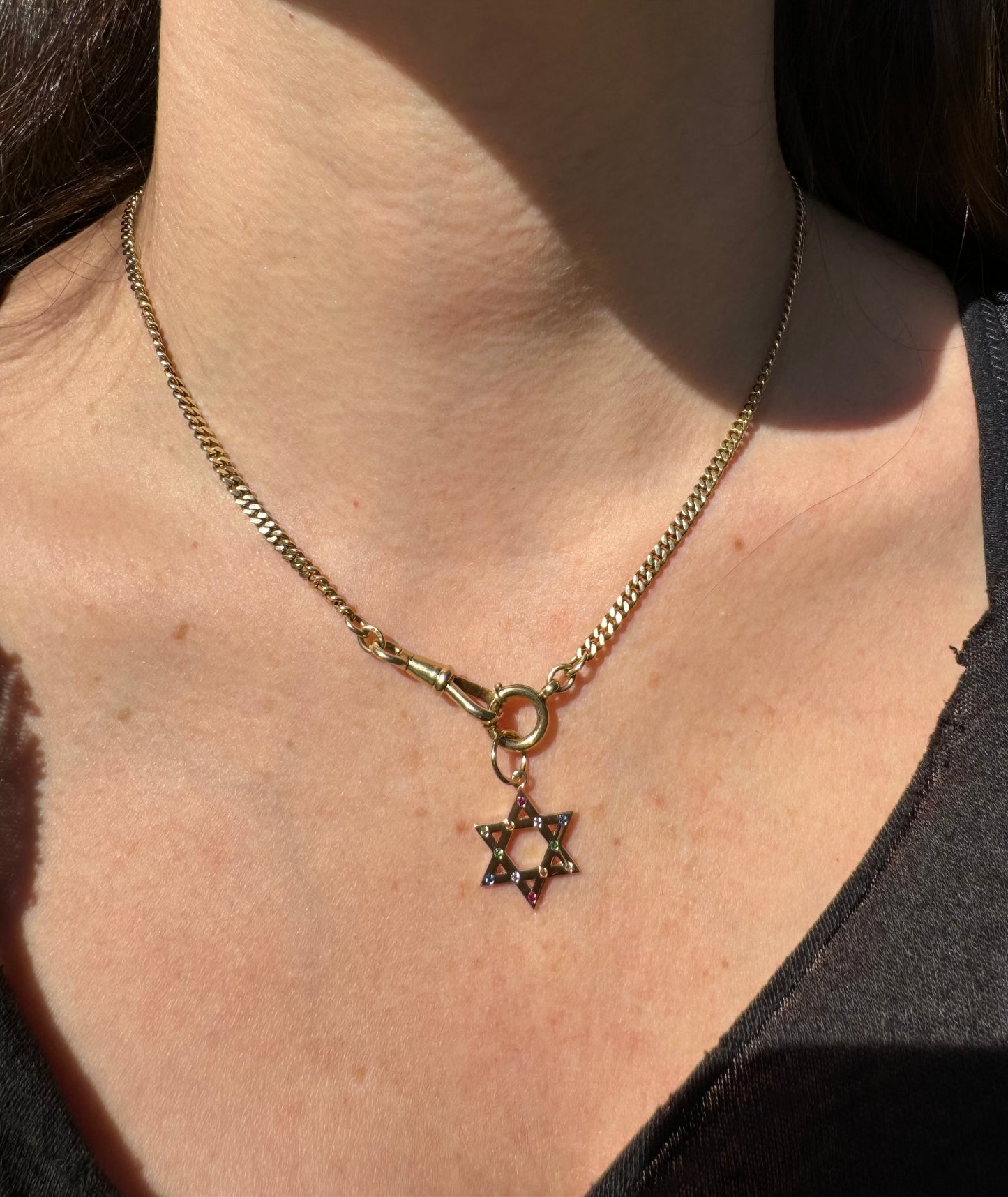 14k yellow gold with rainbow sapphire star!