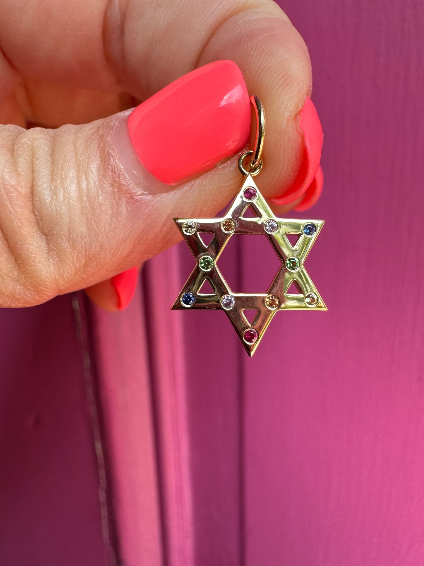 14k yellow gold with rainbow sapphire star!